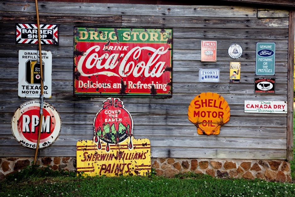 Collection of vintage advertising signs on rustic wooden wall